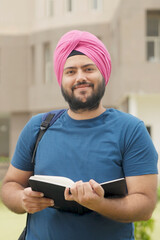 Vertical Photo of Happy Sikh Indian Student Smiling at Camera