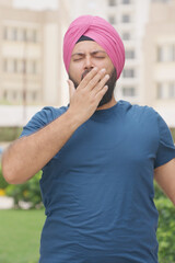 Vertical Photo of Sikh Indian Man Yawning, Feeling Sleepy