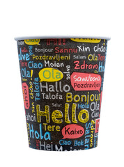 disposable paper coffee cup with a black base adorned with colorful, playful text in various languages, including "Hello," "Bonjour," and "Halo" on white background © Roberto Sorin