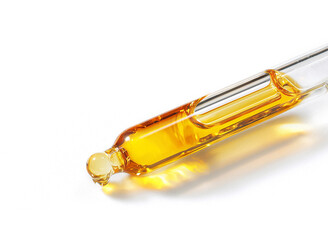 Naklejka premium glass pipette of serum on white background 