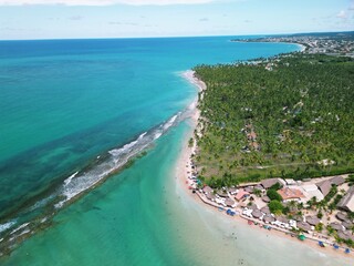 Aerial view from Praia dos Carneiros, Pernambuco: turquoise sea, white sandy beach, endless palm...
