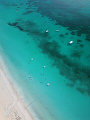 Aerial drone view of Seven Mile Beach in Negril, Jamaica, revealing crystal-clear Caribbean waters,...