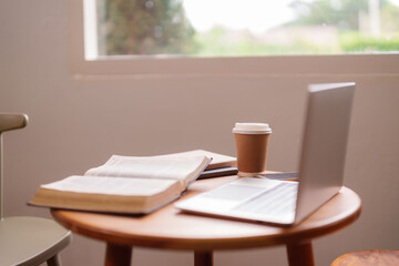 Work from home study space tranquil environment remote working tools laptop book coffee cozy home office productivity window light