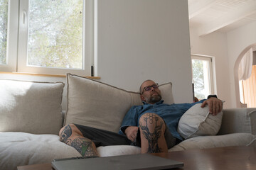 Man relaxing on the sofa at home