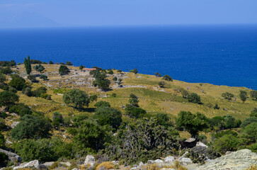 Coastal Countryside with Stone House and Deep Blue Sea