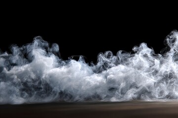 Wispy white smoke billows across a dark surface against a stark black backdrop