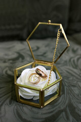 Glass box with wedding rings. Preparation for marriage.