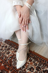 The bride is getting dressed and preparing for the wedding ceremony.