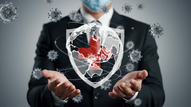 Man in Suit and Mask Holding Digital Shield with Red Cross and Globe Surrounded by Virus Particles on Gray Background Concept - Powered by Adobe