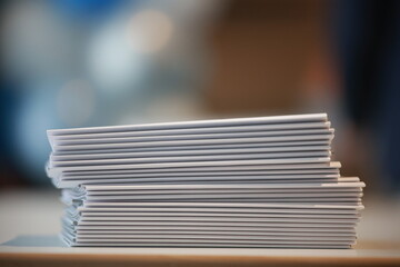 Stack of white papers on a table