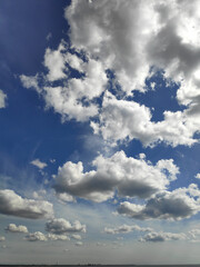 The sky is blue with many clouds