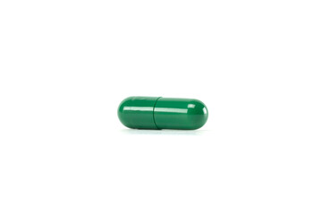 Green capsule of herbal medicine for health. A natural vitamin supplement for healthcare isolated...