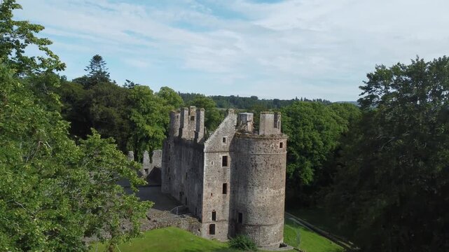 slow arial drone footage of scottish huntly castle ruin epic dramatic views closeup abandoned building tourist attraction no people
