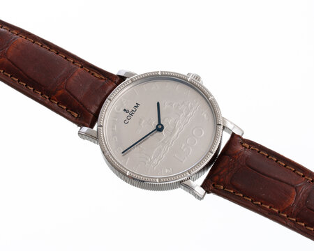 Corum watch, 500 Lire model, reference 082.645.40_0001 self-winding watch with 500 Lire dial in silver. Milan. Italy April 14_ 2025