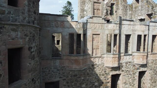 slow arial drone footage of scottish huntly castle ruin epic dramatic views closeup abandoned building tourist attraction no people