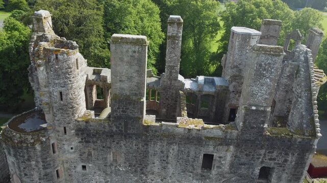 slow arial drone footage of scottish huntly castle ruin epic dramatic views closeup abandoned building tourist attraction no people