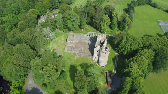slow arial drone footage of scottish huntly castle ruin epic dramatic views closeup abandoned building tourist attraction no people