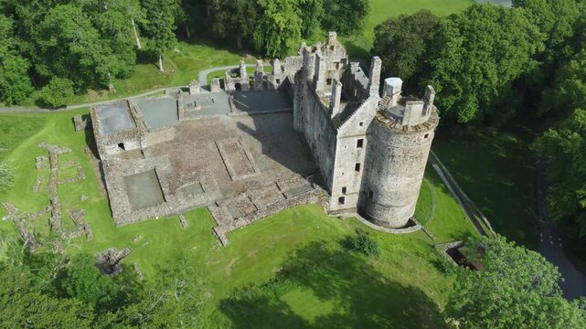 slow arial drone footage of scottish huntly castle ruin epic dramatic views closeup abandoned building tourist attraction no people