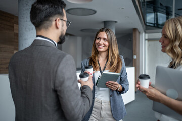 Business people chatting during coffee break at conference