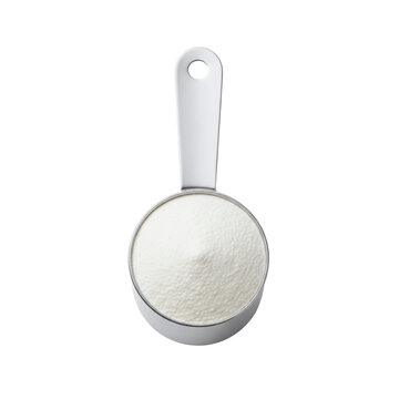 Metal measuring cup filled with flour or powder

