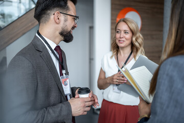 Business people networking during coffee break at corporate event