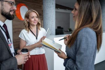Business people discussing during coffee break at conference