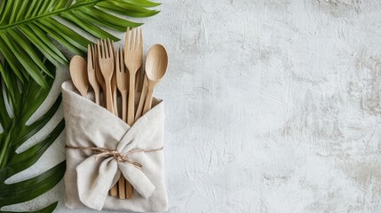 Natural Wooden Cutlery in Eco-Friendly Bag on Light Background