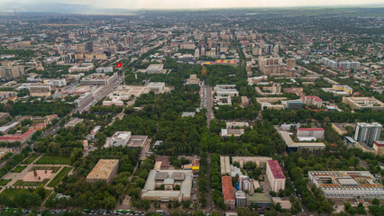Obraz premium Panoramic drone footage of the capital city of Kyrgyzstan, Asia, featuring the iconic white mosque and the unique mix of modern and Soviet-era architecture in Bishkek