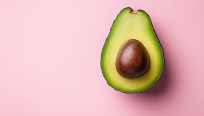 Tropical Abstract: Avocado On Pink Background. Top View Of Fresh Avocado Spread On A Pink Surface. Food And Nature Inspired Artistic Design.