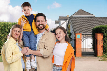 Family with two kids near their house outdoors
