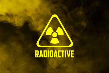 Radioactive sign and yellow toxic smoke against black background