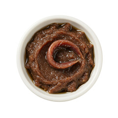 A close-up view of a bowl containing rich, savory paste with an anchovy accent, ideal for culinary use