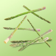 Fresh asparagus falling on green gradient background