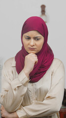 Vertical Photo of Stressed Muslim Woman in Hijab Scarf