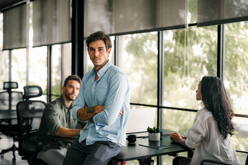 Team of industrial design agency specialists, software engineer programmers discussing in office