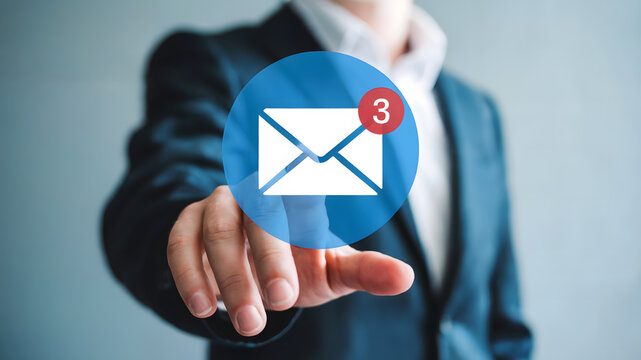 Businessman's finger reaching for notification icon showing unread messages, symbolizing digital communication and connectivity