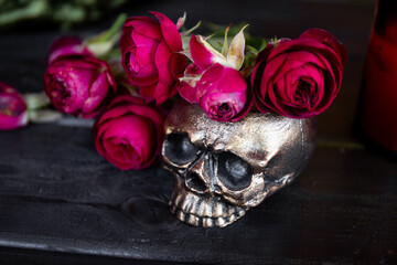 Skull with red roses on black background, Halloween concept card