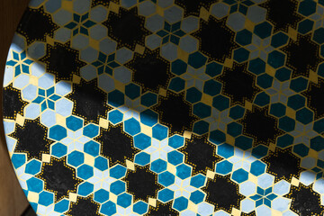 Colorful Islamic Geometric Tile Art with Sunlight and Intricate Patterns