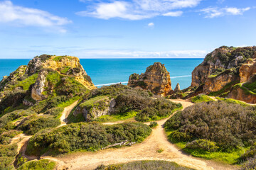 Ponta da Piedade - famous rock formations with caves and grottoes on the ocean shore in Lagos,...
