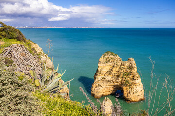 Ponta da Piedade - famous rock formations with caves and grottoes on the ocean shore in Lagos,...