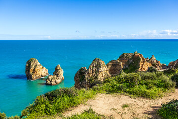 Ponta da Piedade - famous rock formations with caves and grottoes on the ocean shore in Lagos,...