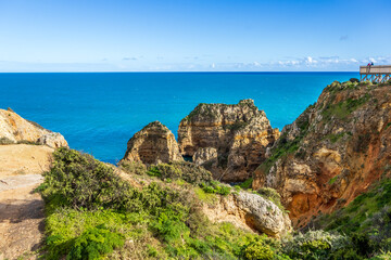 Ponta da Piedade - famous rock formations with caves and grottoes on the ocean shore in Lagos,...