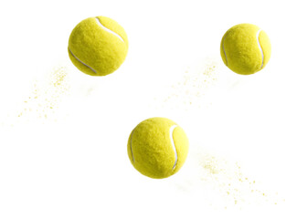 Yellow tennis balls flying with dust isolated on a transparent background particles