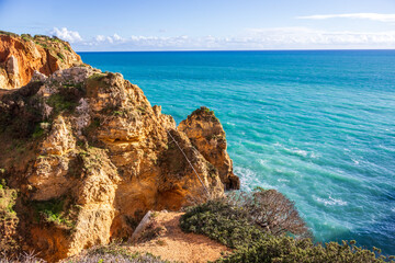 Ponta da Piedade - famous rock formations with caves and grottoes on the ocean shore in Lagos,...