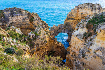 Ponta da Piedade - famous rock formations with caves and grottoes on the ocean shore in Lagos,...