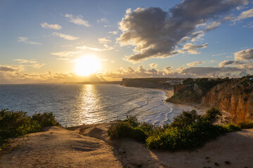 Ponta da Piedade - famous rock formations with caves and grottoes on the ocean shore in sunset time...