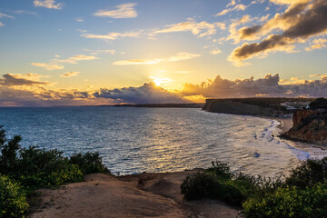 Ponta da Piedade - famous rock formations with caves and grottoes on the ocean shore in sunset time...