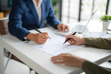Businessmen working together at desk.