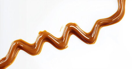 Sweet caramel sauce drizzled on white background creating a zigzag pattern