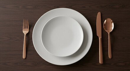 Elegant place setting with rose gold cutlery and white plates